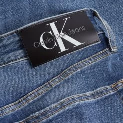 Calvin Klein Jeans Jean Coupe Slim Calvin Klein Slim Taper En Coton Mélangé Bleu Indigo -Passons à la mode masculine ! 105740 136301vt jean coupe slim calvin klein slim taper en coton melange indigo 05 600x600
